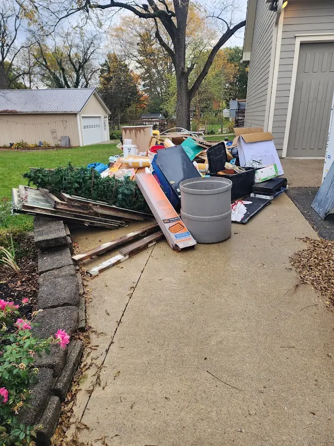 Dumpster being loaded with debris for Residential Dumpster Rental in Gallup